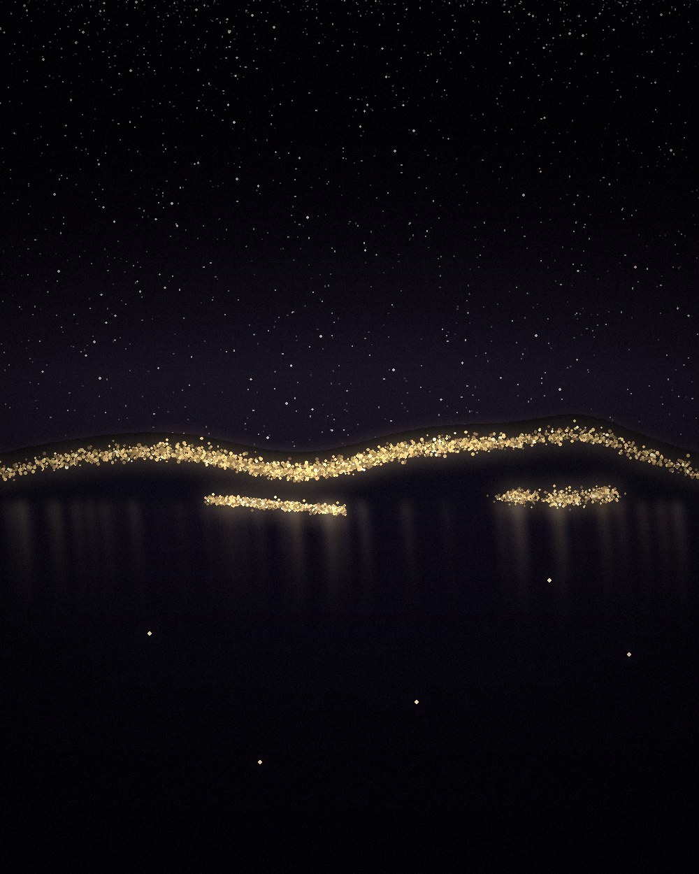 An island harbour town after dark, its lights strung along the bay and reflected in the water.